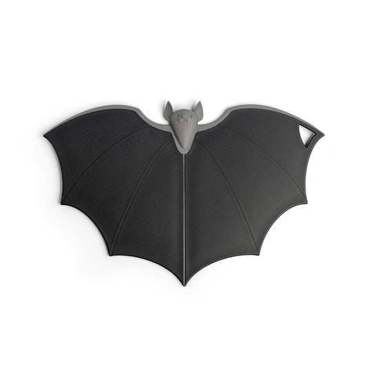 Batty trivet by OTOTO, bat-shaped in dark gray with a hole and folding wings at one wings tip.