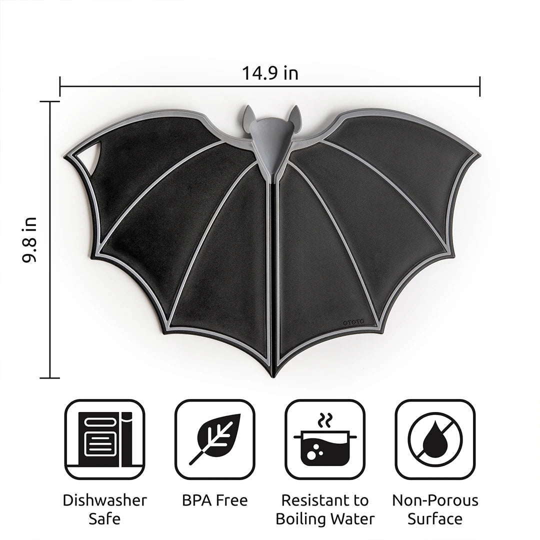 The OTOTO Batty black bat-shaped kitchen mat has folding wings, is dishwasher safe, BPA-free, and compact.