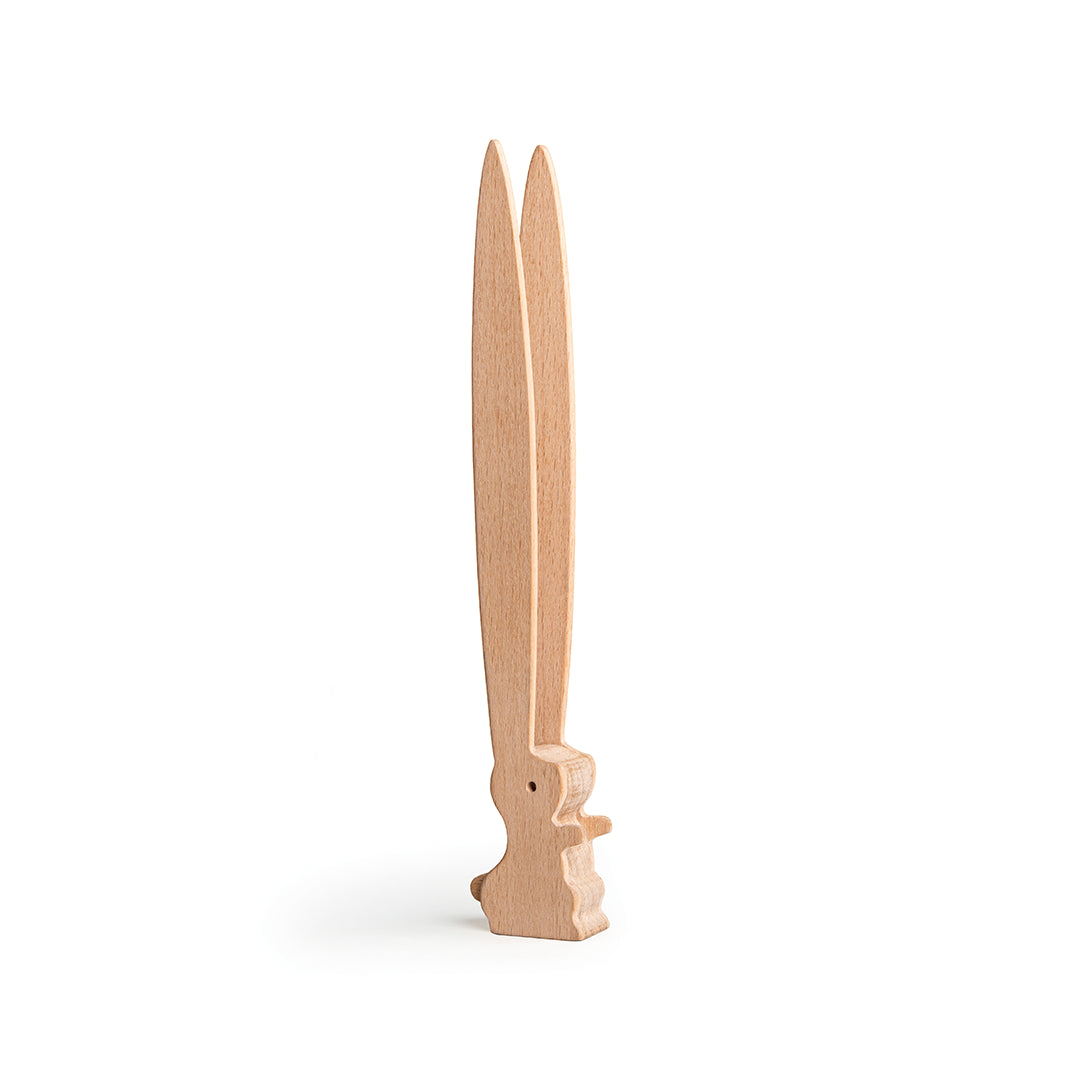 OTOTOs Bernie, designed by Ste Smith, is a wooden figure resembling upright rabbit ears on a white background.