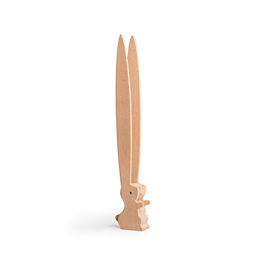 OTOTOs Bernie, designed by Ste Smith, is a wooden figure resembling upright rabbit ears on a white background.