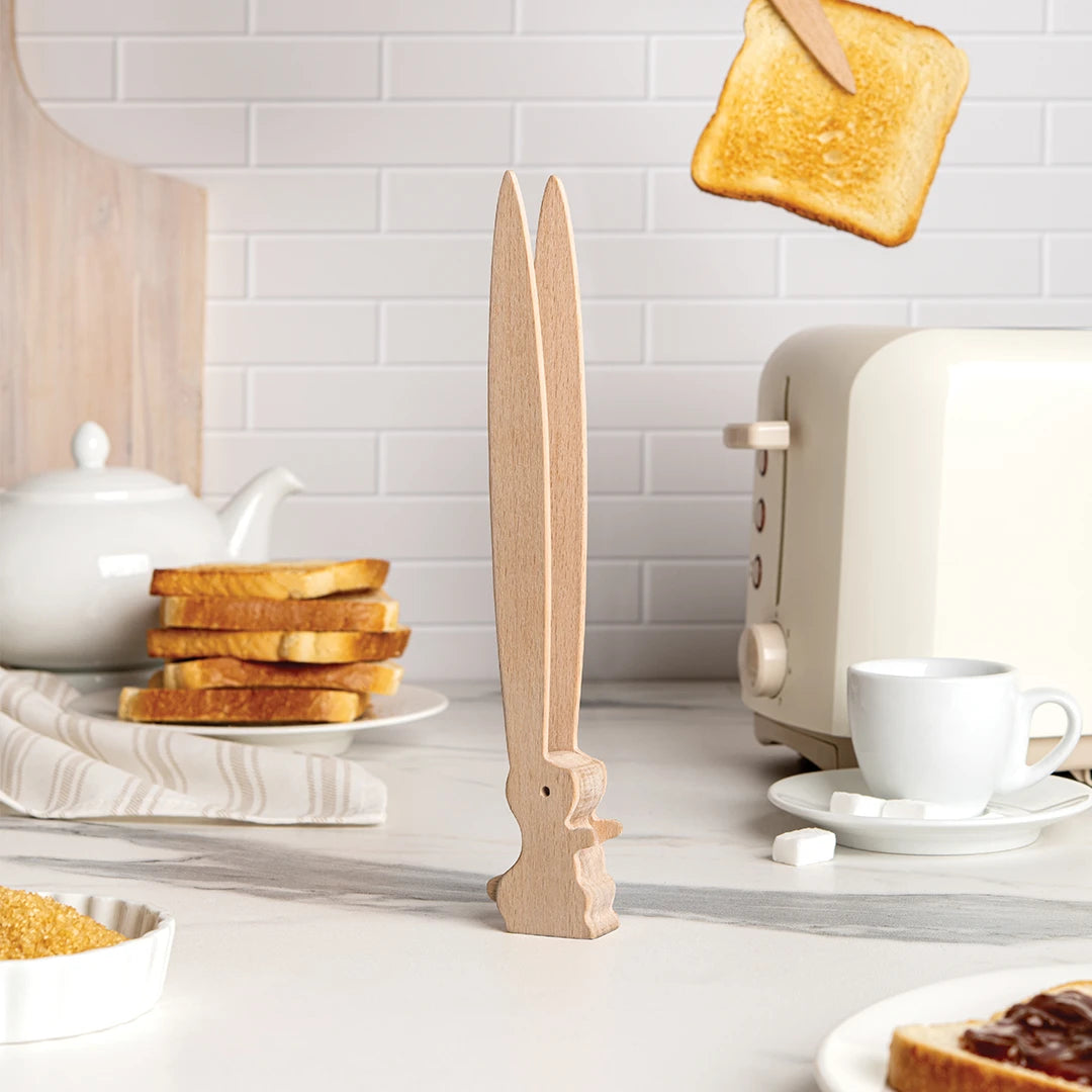 Bernie wooden sword joins flying toast, toaster tongs, and stacked bread in Ste Smiths quirky kitchen.