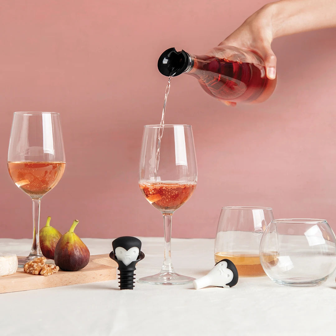 A wine-loving vampire serves rosé with OTOTOs Count Corkula, figs, nuts, and cheese on the table.