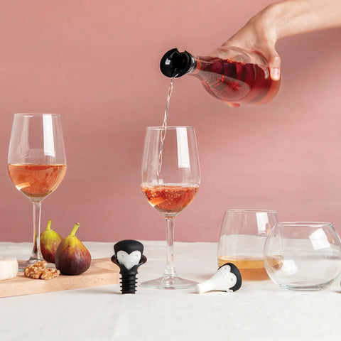 A wine-loving vampire serves rosé with OTOTOs Count Corkula, figs, nuts, and cheese on the table.