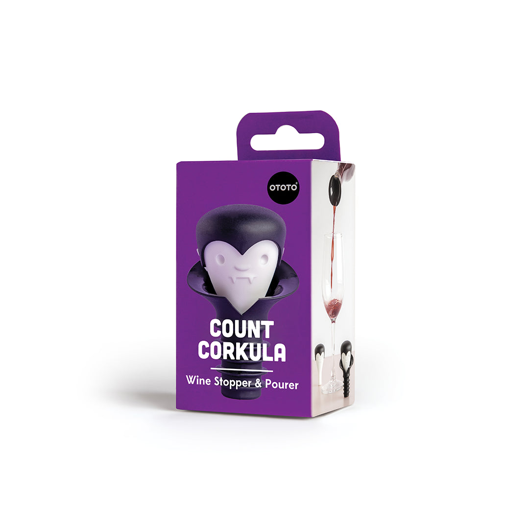 Purple box of OTOTOs Count Corkula wine stopper with a vampire design for wine lovers.
