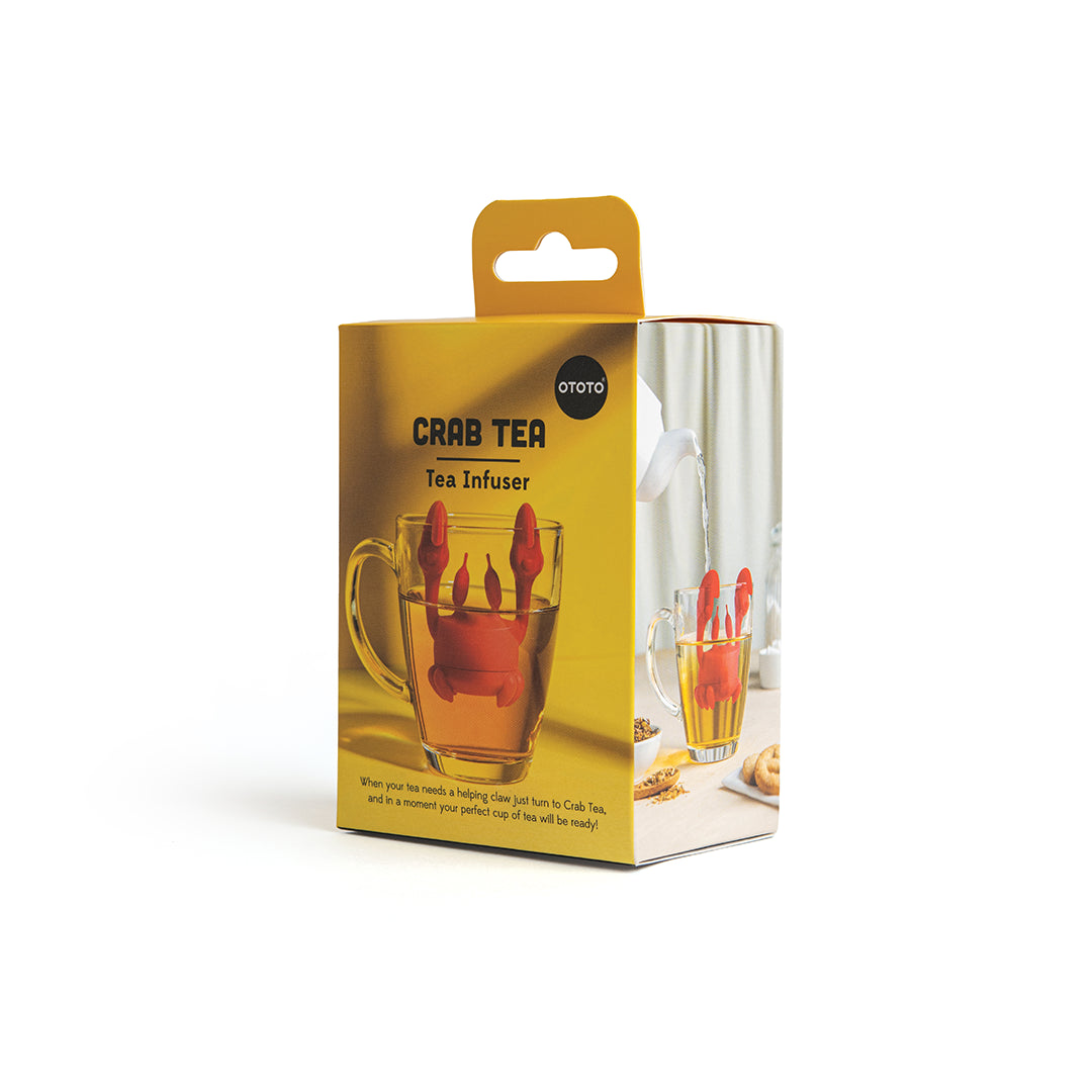 Crab Tea infuser from OTOTO in a box, placed inside a transparent glass mug.