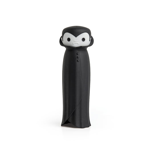 Drac N Roll cartoon vampire figure with a black cape and white face, set on a white backdrop.