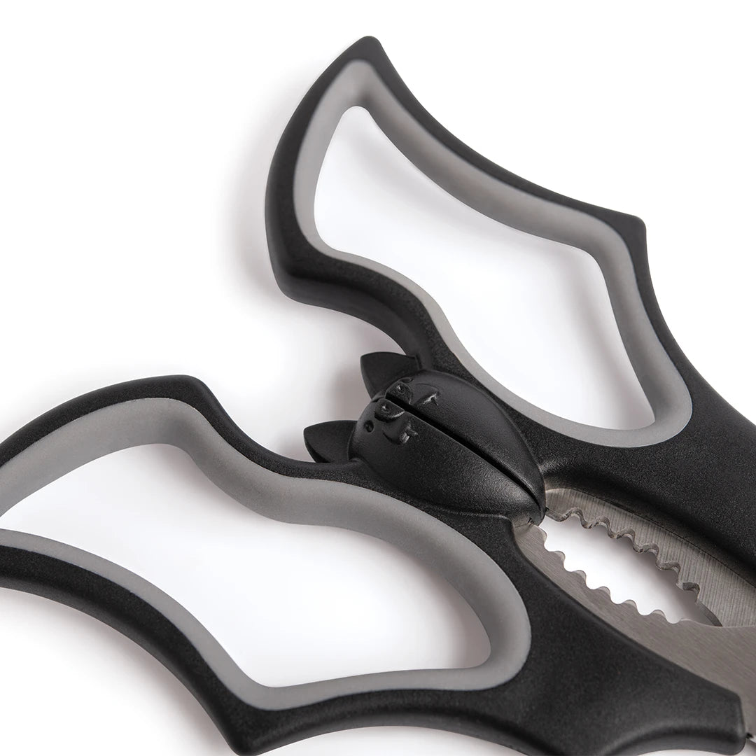 Close-up of OTOTO Elizabat kitchen scissors in black and gray with unique interlocking blade teeth.
