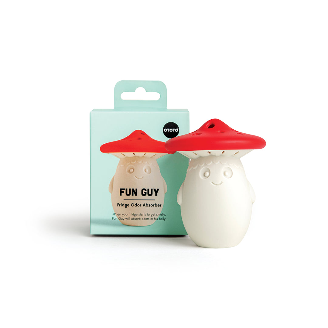 Fun Guy fridge odor absorber by OTOTO with a red cap and smile, next to its packaging.