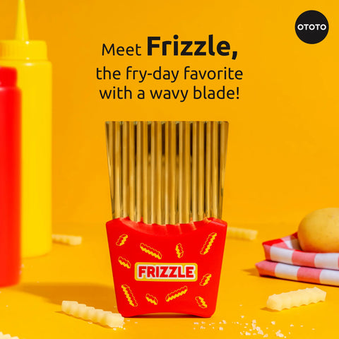The Frizzle crinkle fry cutter sits on a yellow surface with fries and condiments nearby.