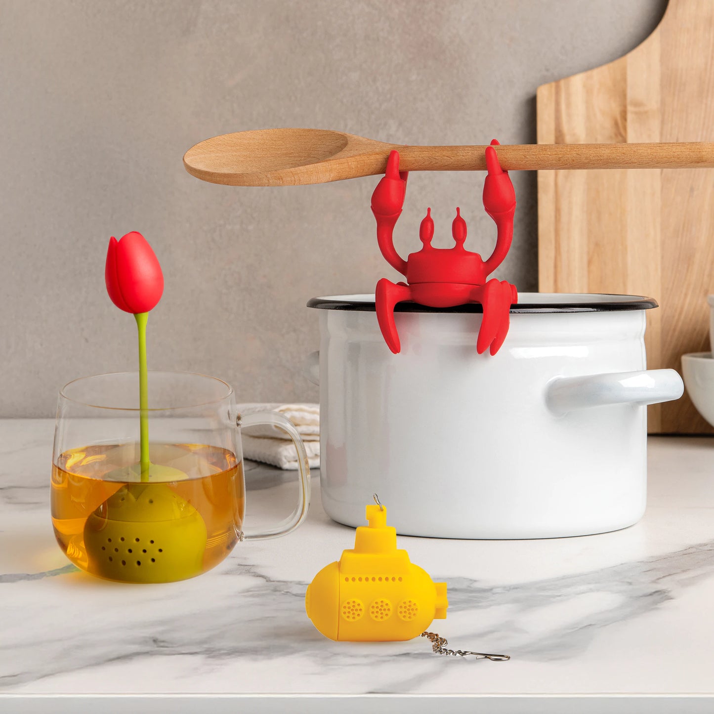 Cute red crab utensil holder; tea infuser in mug; Valentines kitchen with Tea Sub on counter.