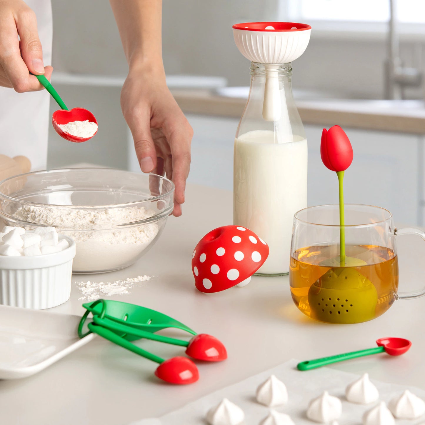 Baking with whimsical tools in a Mon Cherry, Tulip themed setting, featuring red polka dots and tulips.