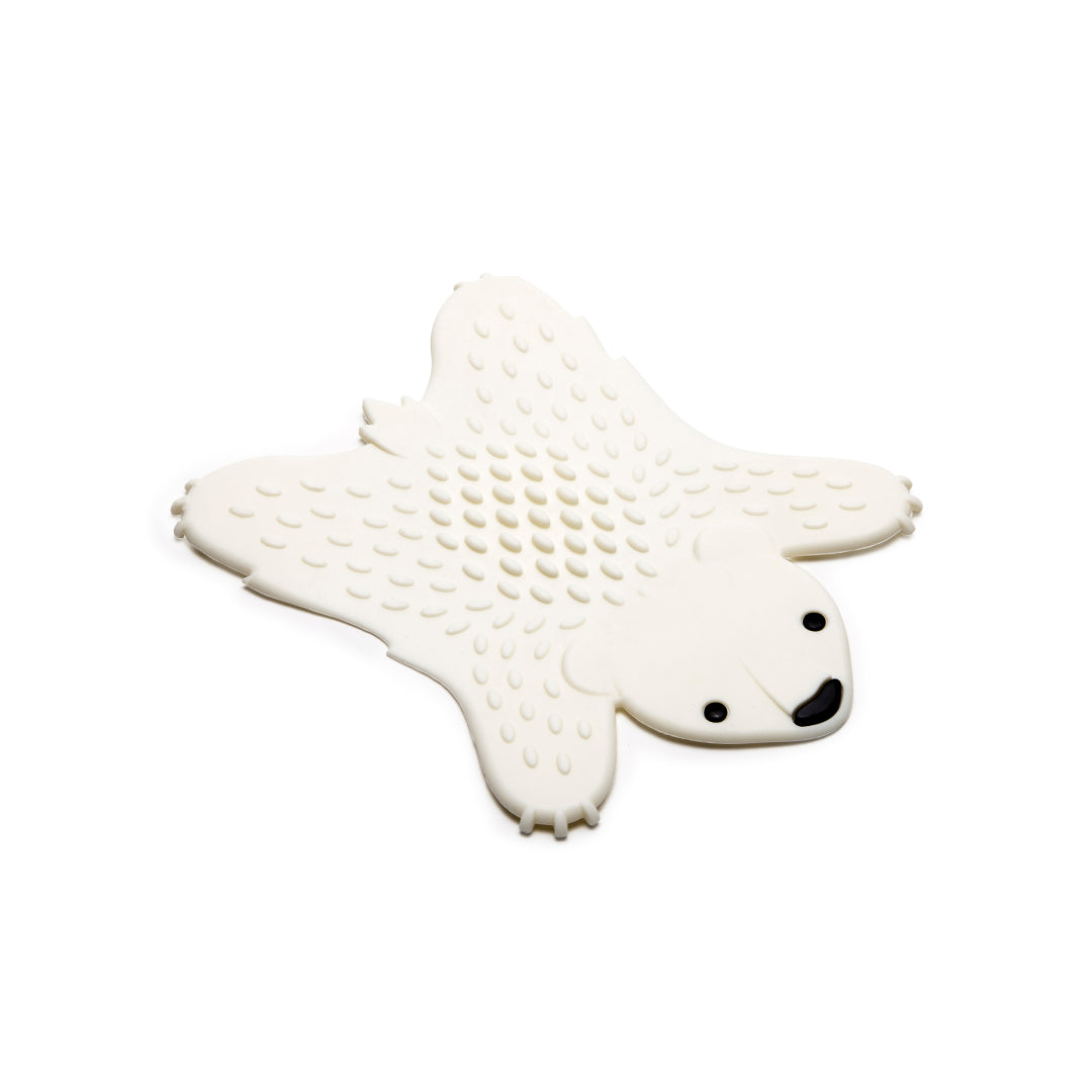 A silicone Grizzly trivet with a textured surface on a plain background.