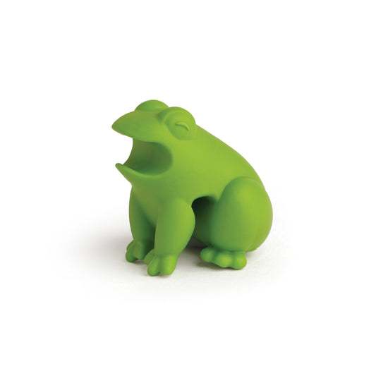 A HopTop, green froggy spoon rest with open mouth, toy-shaped on a white background.