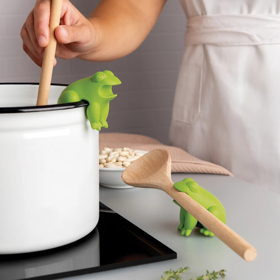 Position the HopTop by OTOTO on the white pot, with another resting on the stove top counter.