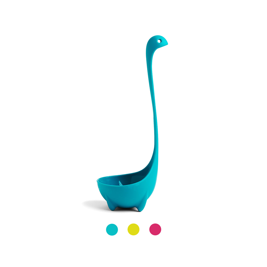 OTOTOs Nessie soup ladle, shaped like a blue dinosaur, stands upright with colorful circles beneath.