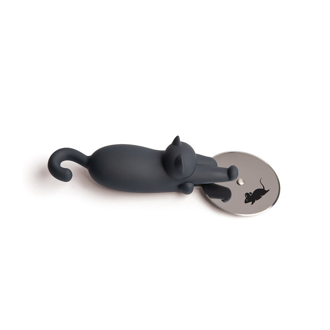 A Kitty-Cut figurine of a black cat reaching for its mouse reflection in a mirror.