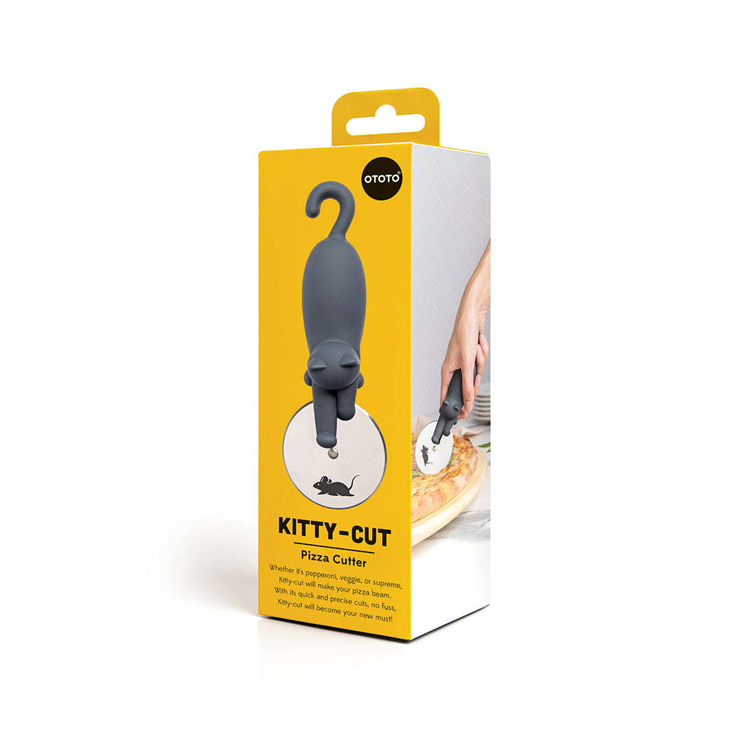 Box of the Kitty-Cut pizza cutter by OTOTO against a playful yellow background.