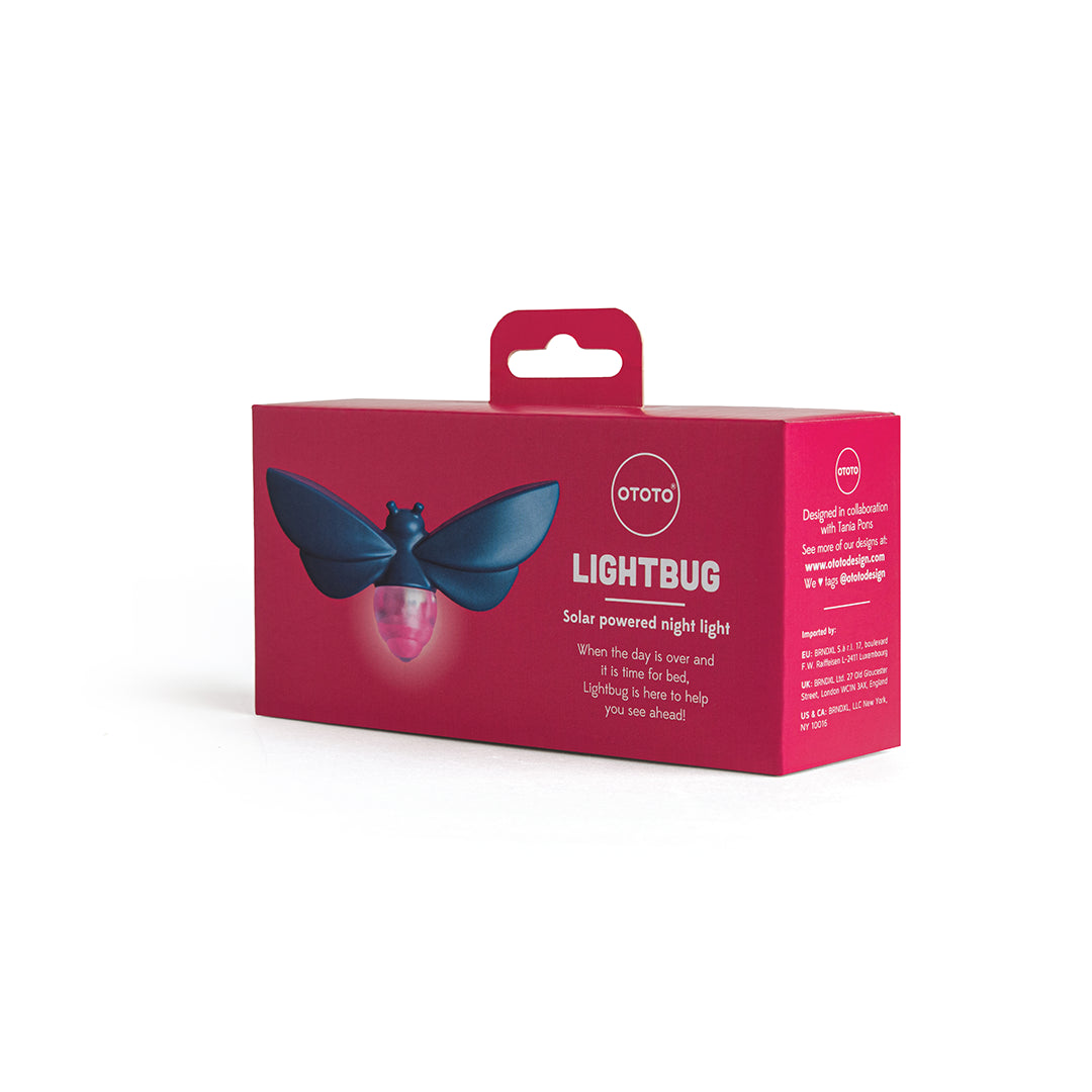 Blue bug-shaped Lightbug night light by OTOTO, solar-powered in red box packaging.
