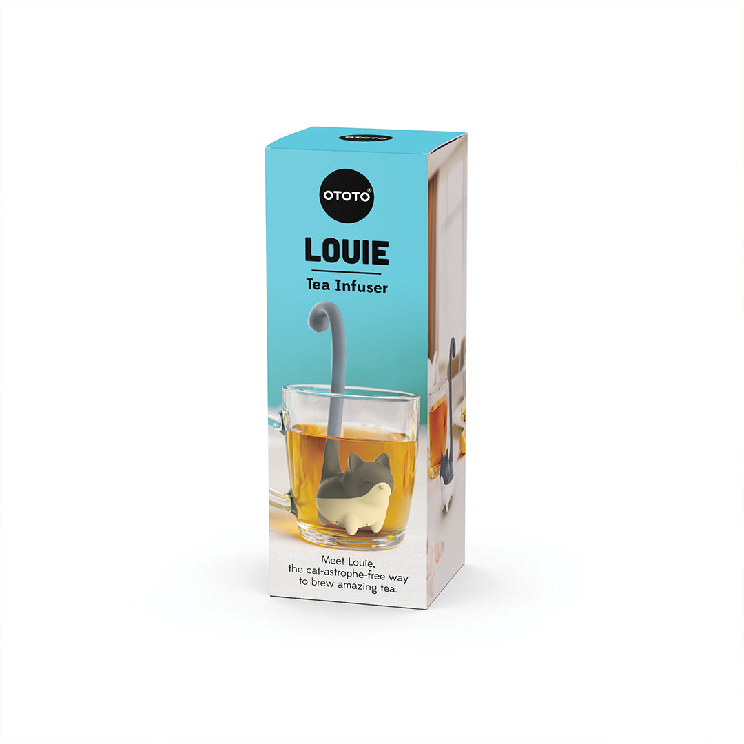 Blue box with OTOTO Louie, a playful cat-shaped tea infuser, shown in a glass cup of tea.