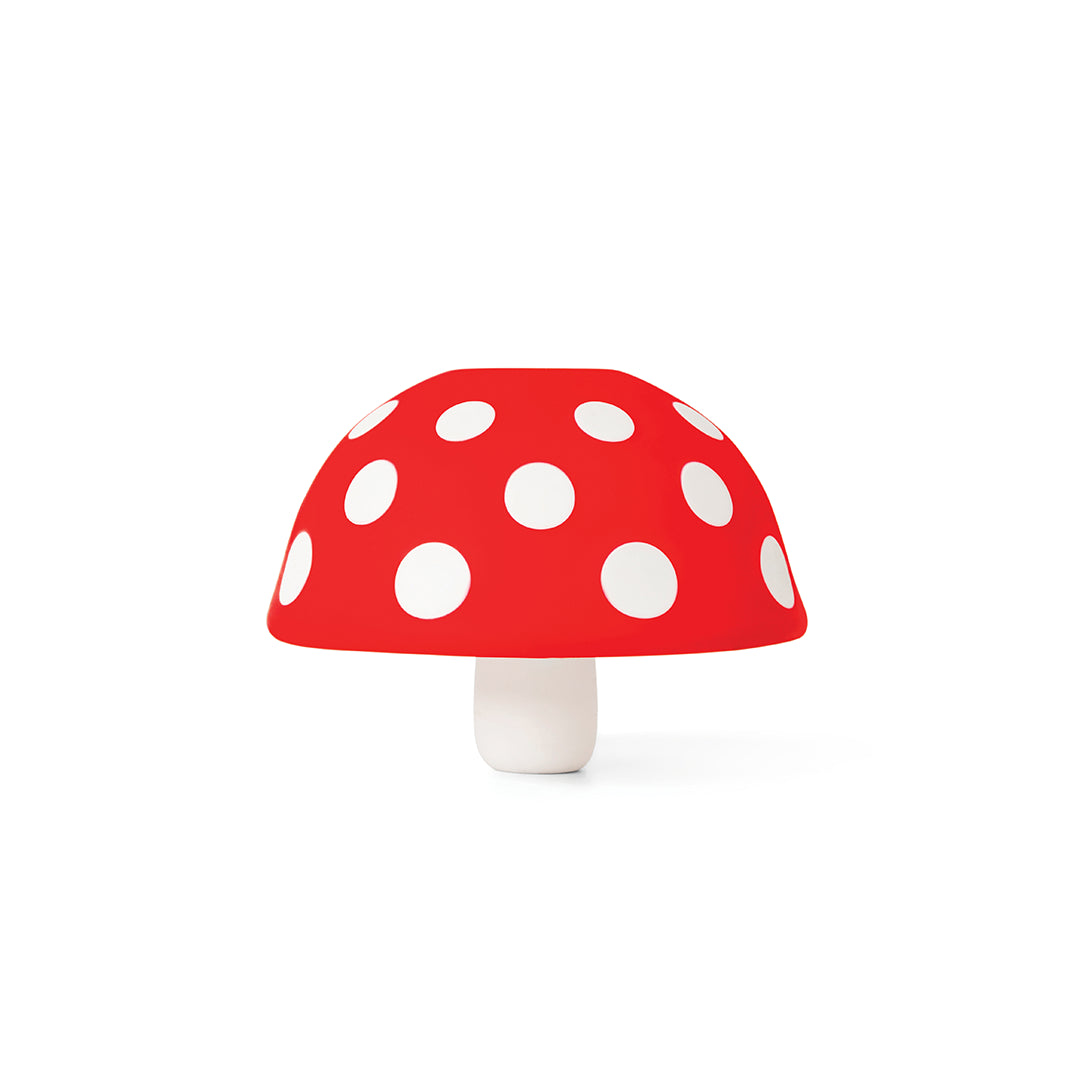 Fungilicious: Red mushroom with white dots, set on a bright white backdrop.