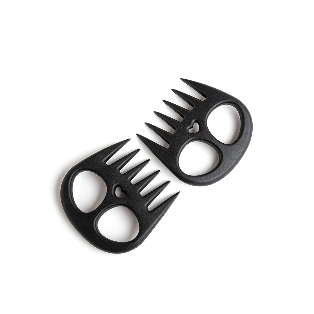 Two Meat Muncher claws, black with heart cutouts, on a white background.
