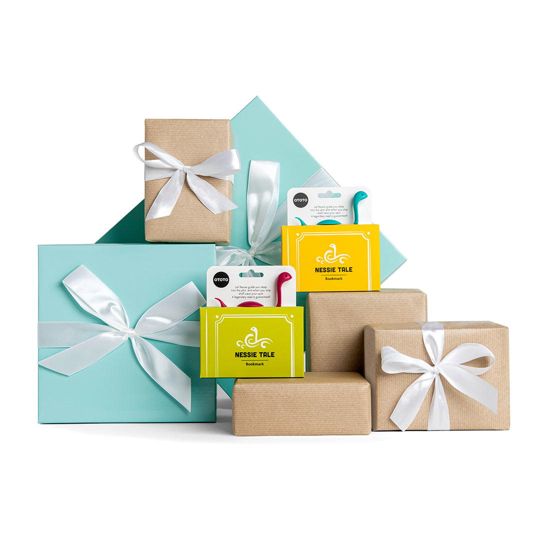 Gift-wrapped presents include two OTOTO Nessie Tale hook packages with ribbons.