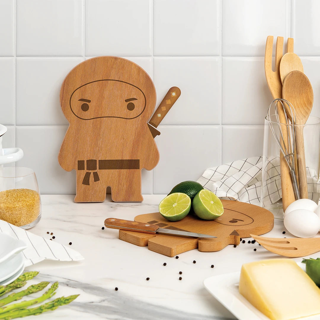 OTOTO Ninja Board with limes, utensils, and cheese on the kitchen counter.