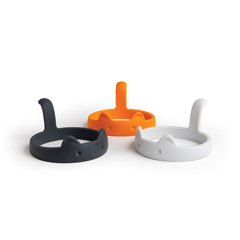 PanCats: Three silicone holders in black, orange, and white with cat ear designs, ideal for frying eggs.