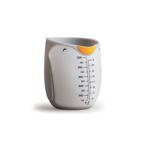 Penny is a cute OTOTO penguin-shaped measuring cup with a yellow beak spout and clear markings.