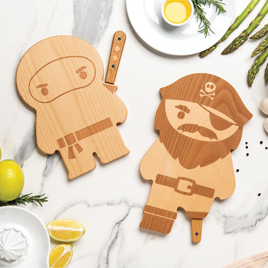 Pirate Board on marble with asparagus, lemons, and wooden ninja cutting board.