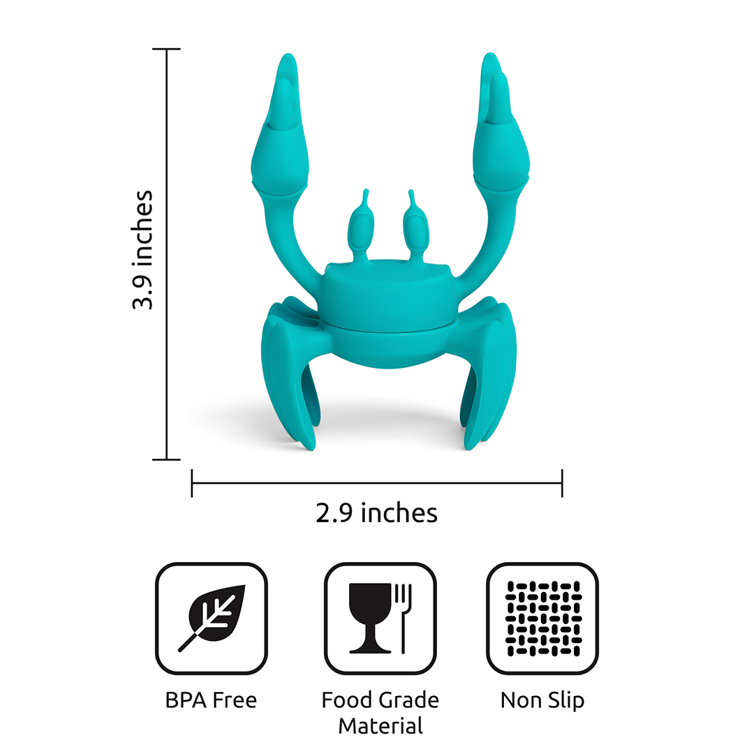 Aqua OTOTO crab-shaped utensil holder, BPA-free, food-grade silicone rest; non-slip design.