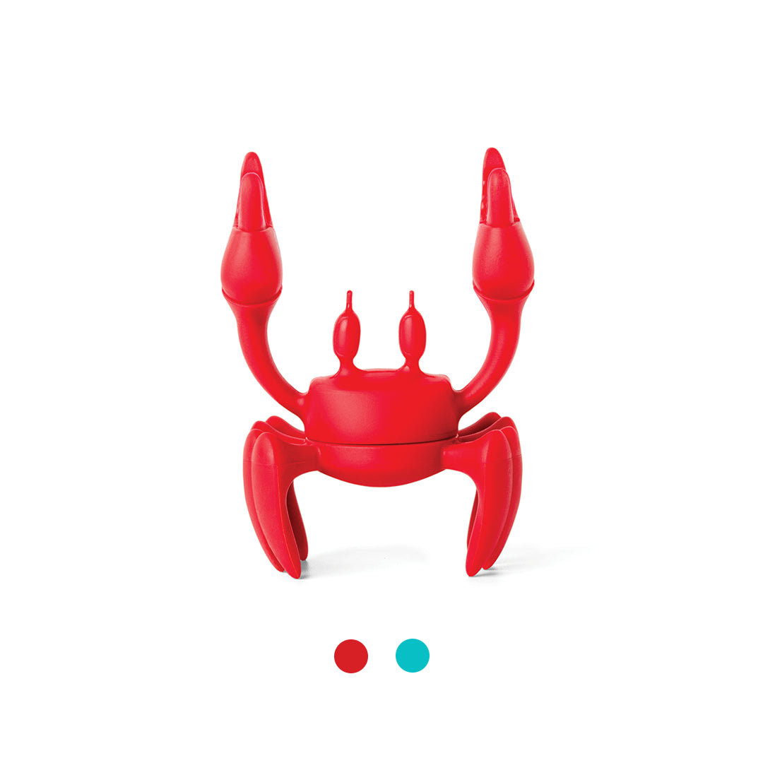 OTOTOs silicone utensil rest, named Red, is crab-shaped and showcased on a white background with samples.
