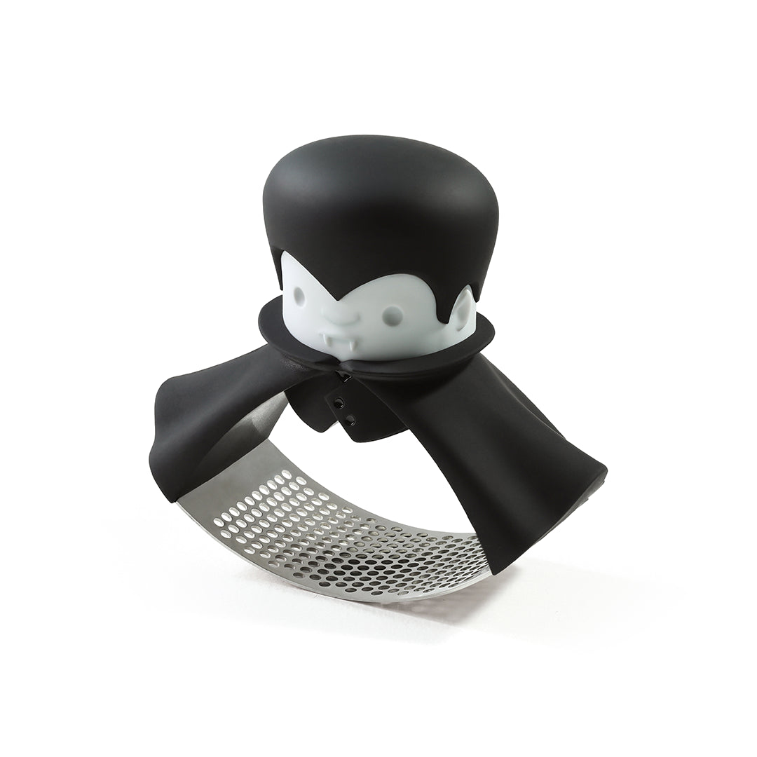 Rockula: Black and white vampire-themed garlic crusher with fangs and cape.