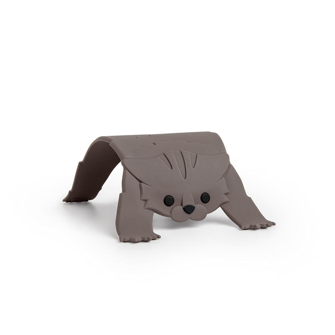 Scaredy Cat trivet made of gray plastic on a white background.
