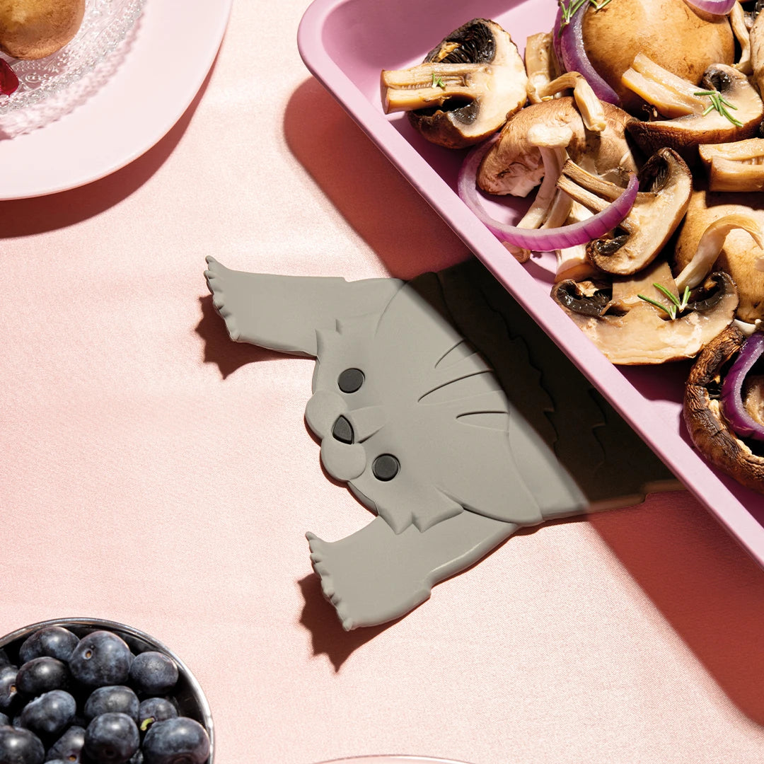 OTOTOs Scaredy Cat: A whimsical cat-shaped kitchen holder peeking out from under your veggies and tray.