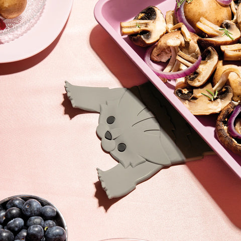 OTOTOs Scaredy Cat: A whimsical cat-shaped kitchen holder peeking out from under your veggies and tray.