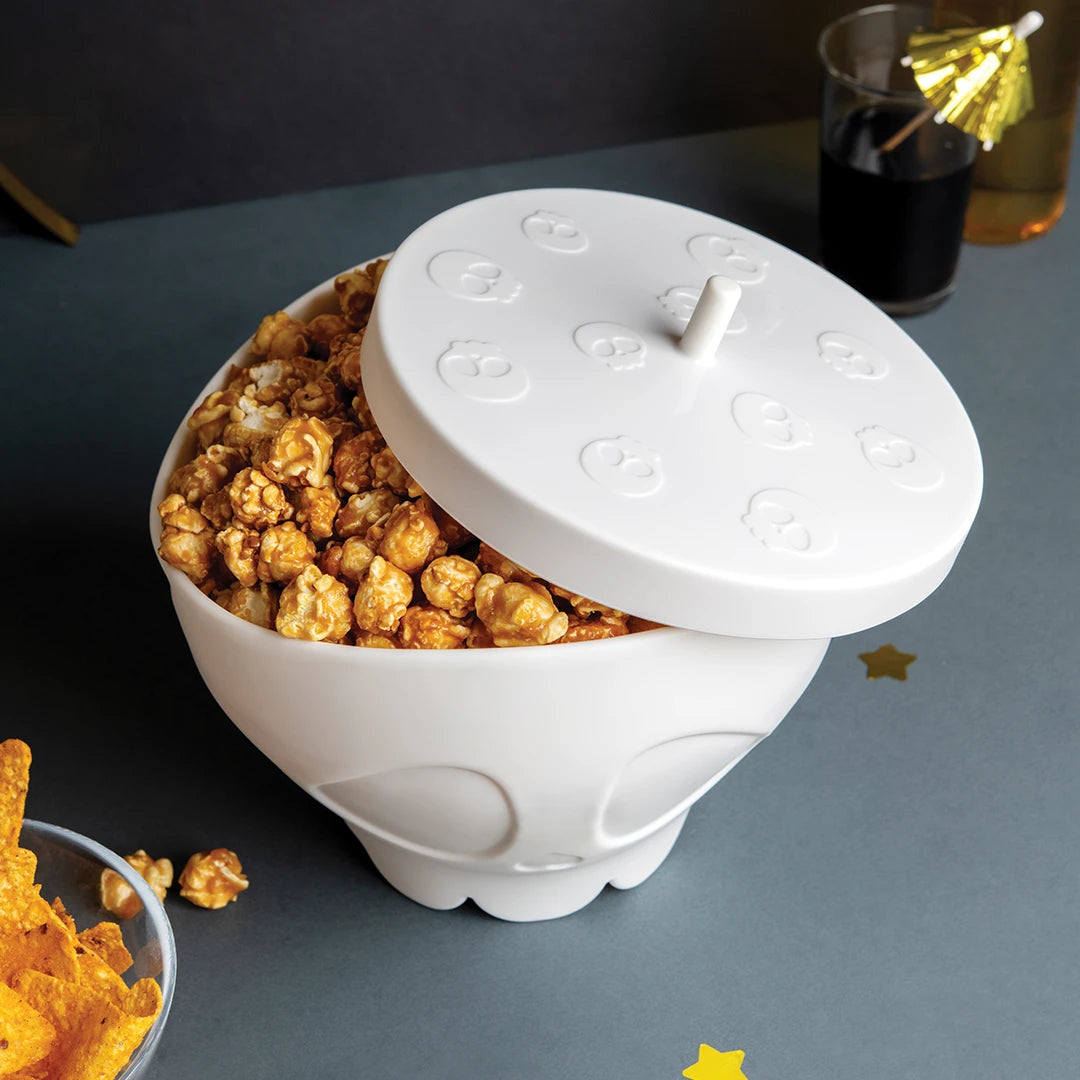 A white skull bowl of caramel popcorn called Scary Poppings adds a fun fright-night twist.