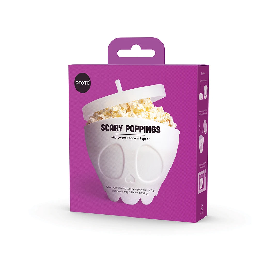 OTOTOs Scary Poppings popcorn popper: a skull-shaped, purple box for a thrilling fright-night twist!.
