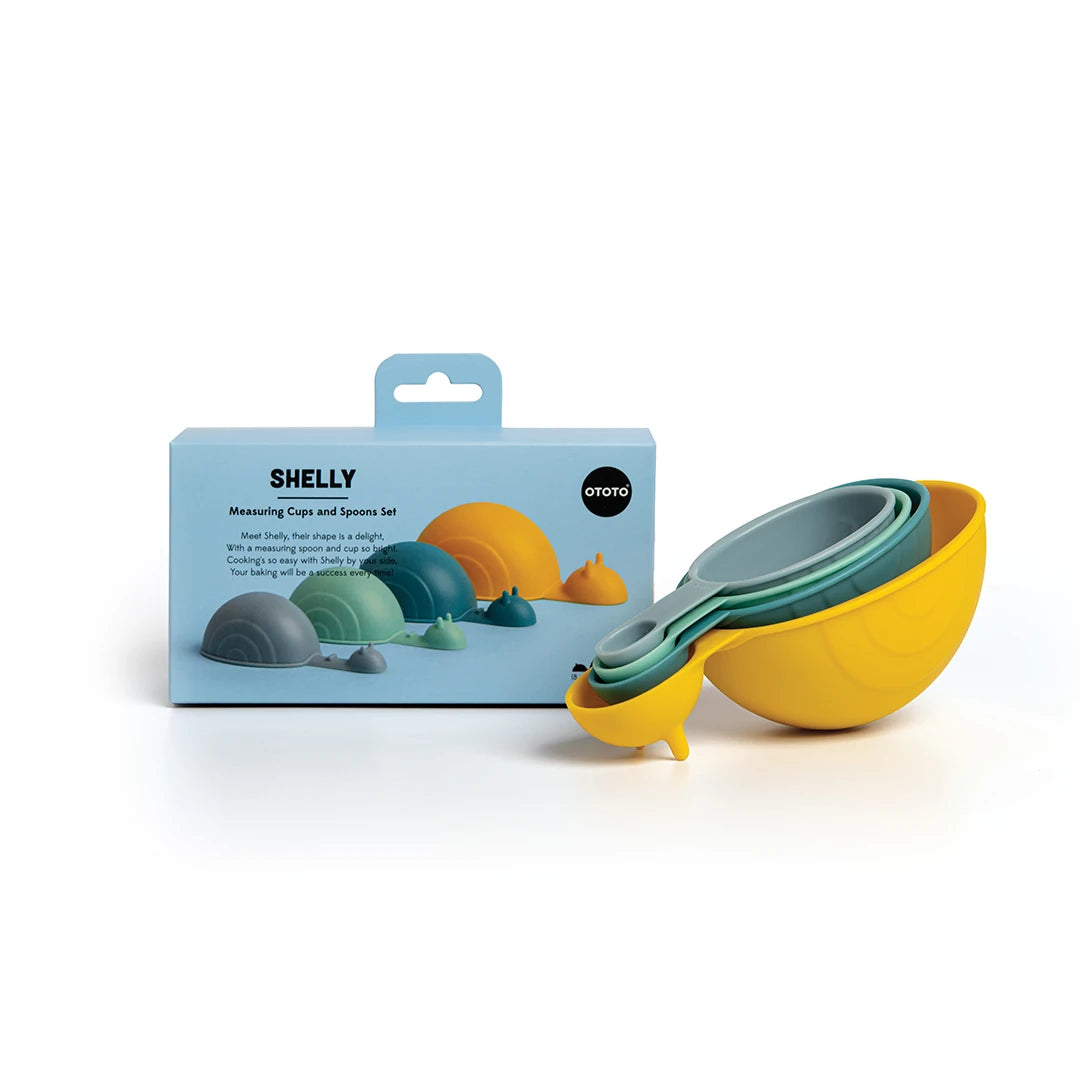 OTOTOs colorful Shelly snail-shaped measuring cups sit next to their packaging on a white background.