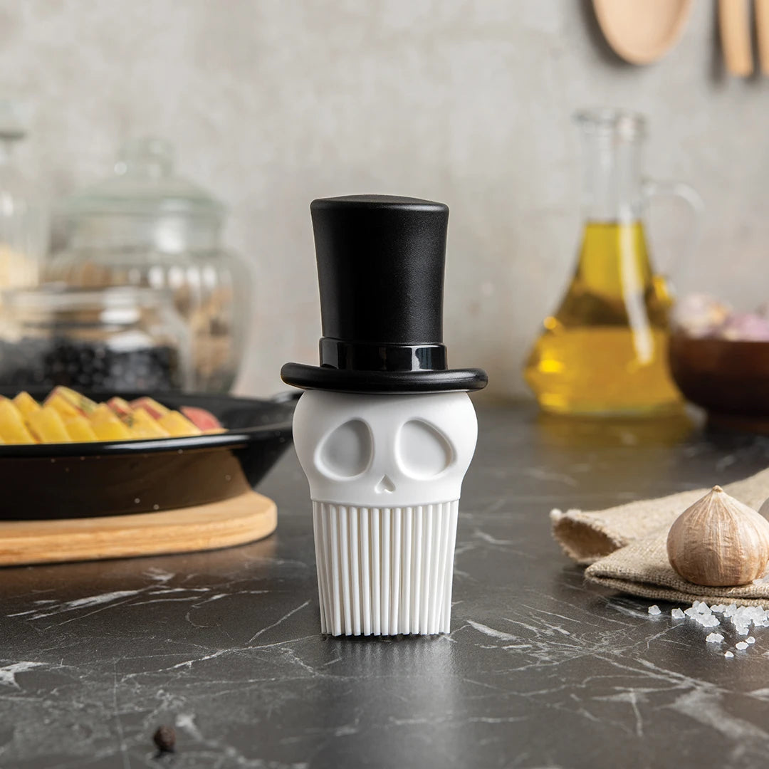 Skully: a skeleton-shaped kitchen brush with a top hat, perfect for cooking adventures.
