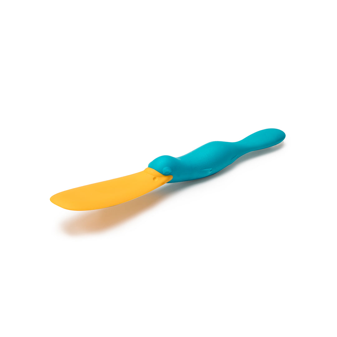 Splatypus by OTOTO, a blue and yellow baby spoon with a flexible handle on a white background.
