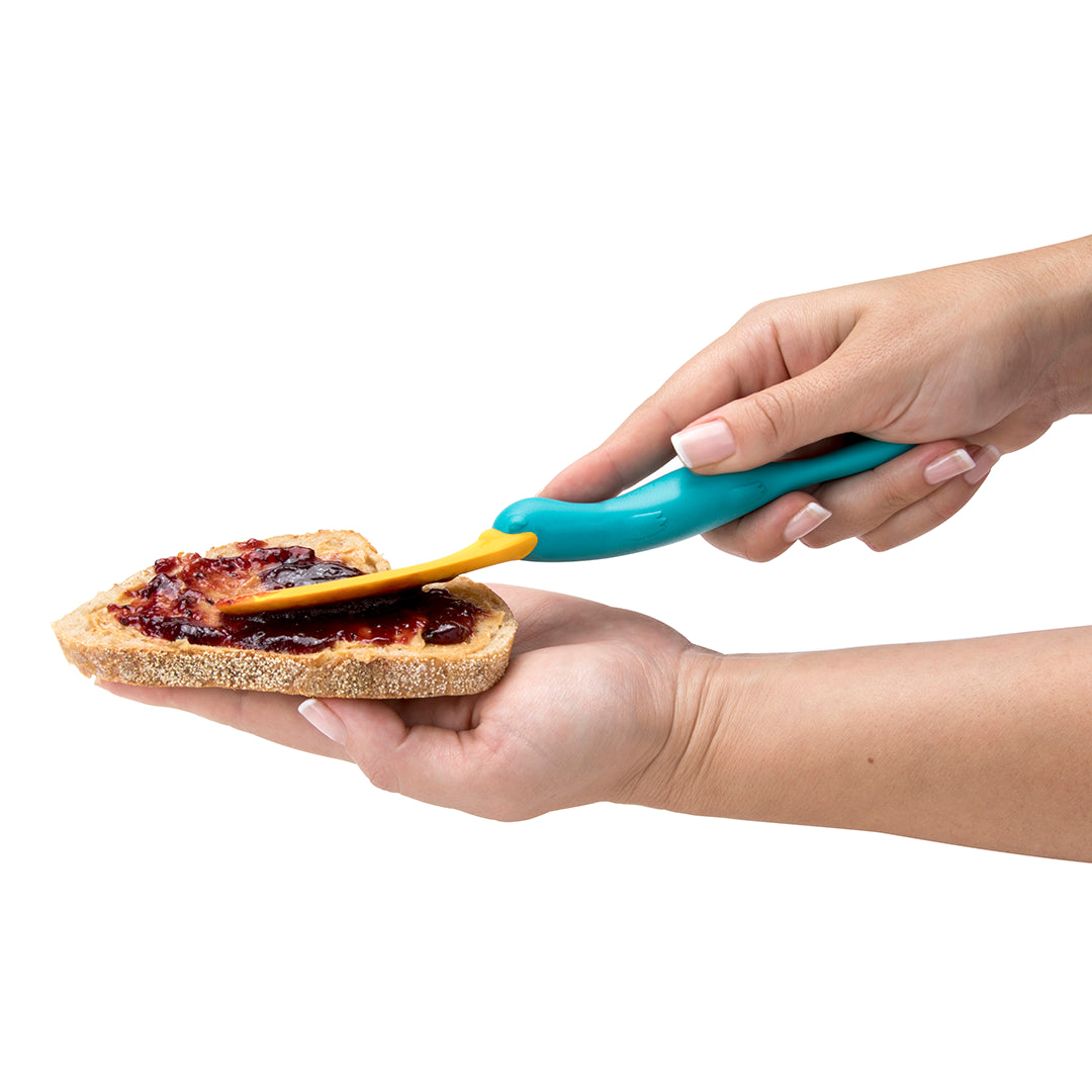 Spread jelly with the ergonomic handle of a turquoise OTOTO Splatypus on your bread.