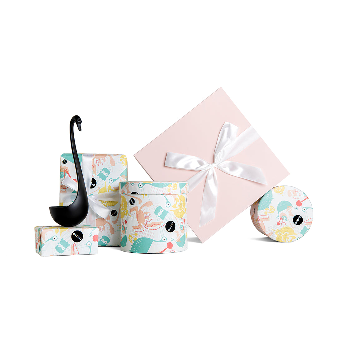 Swanky abstract design gift boxes feature a floating ladle with one box adorned with a ribbon.
