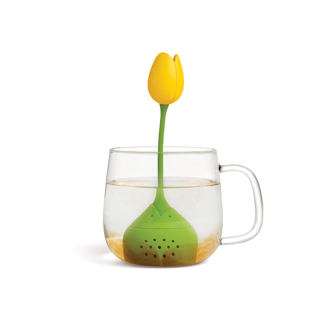 A Tulip infuser by OTOTO blooms in a mug, releasing delightful teas and flavors.