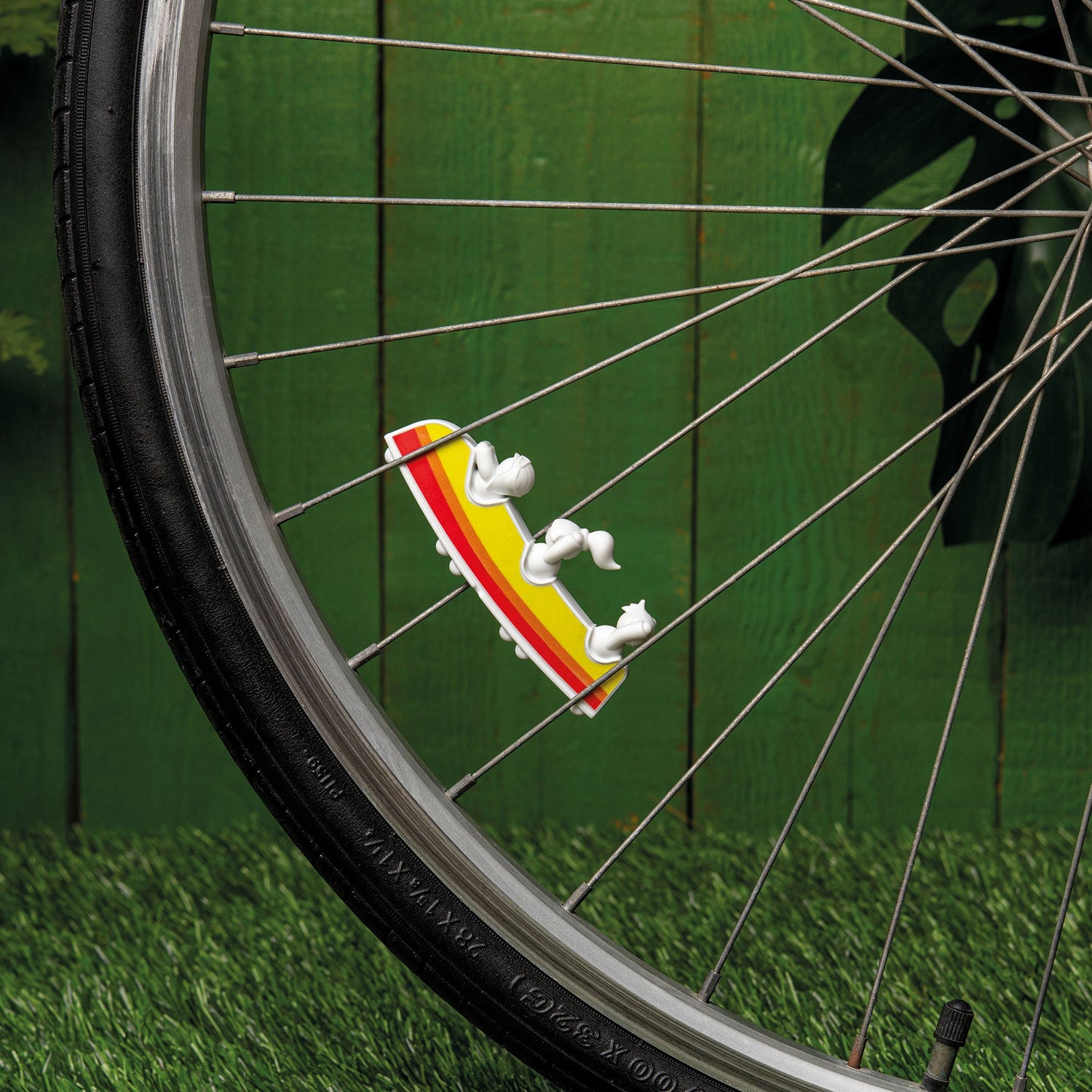 Rollerama: A bicycle wheel with a yellow and red sneaker on the spokes, perfect for adventure backdrops.