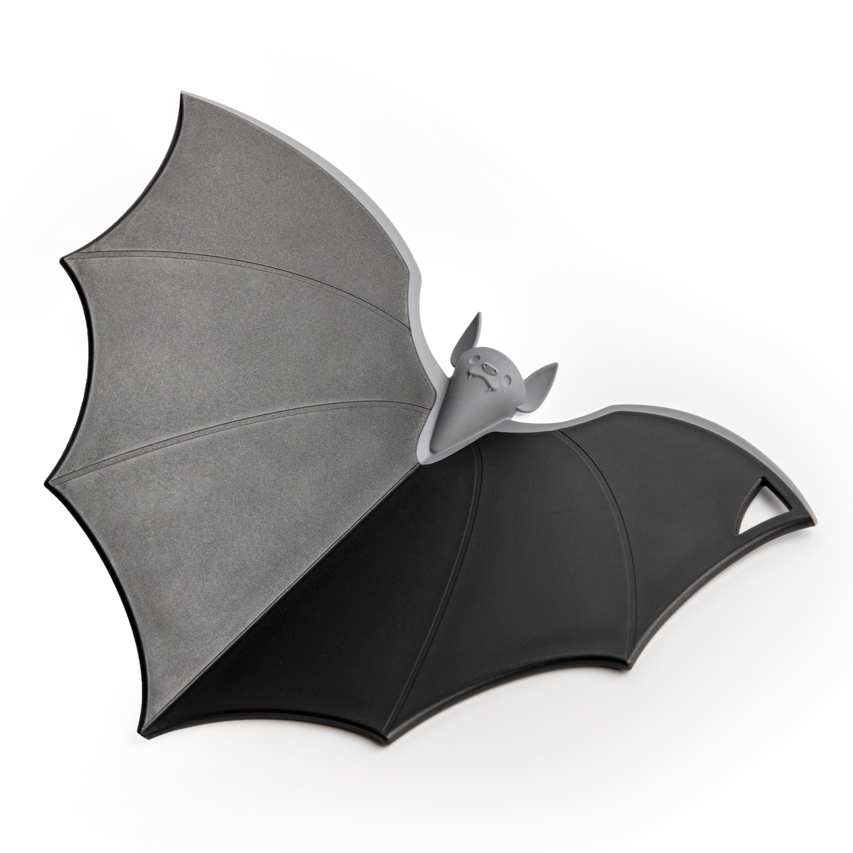 Batty: A spooky-cute chopping board by OTOTO, bat-shaped with a cute face and gray-black wings.