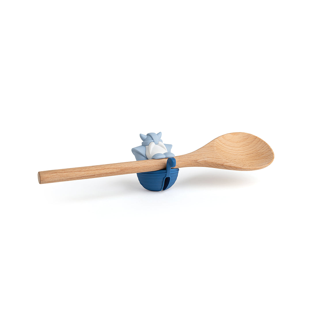 Bjorn spoon holder features a wooden spoon on a blue, cat-shaped steam releaser.