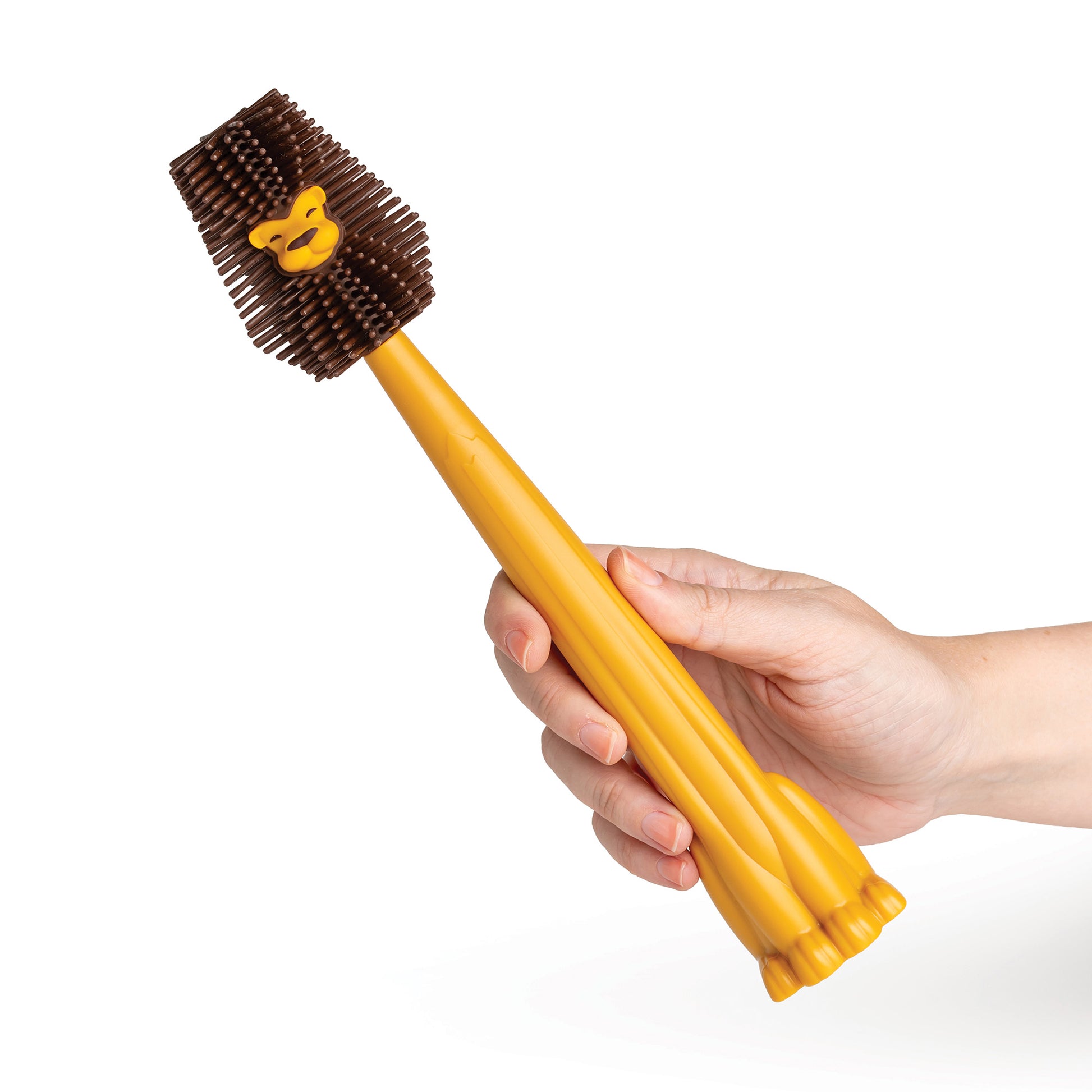 A hand holds an OTOTO Cleo bottle cleaner with a yellow brush and a paw-shaped silicone handle.