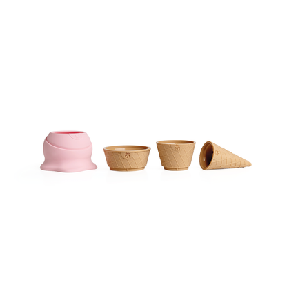 Coney: four toy ice cream parts—a pink scoop and three cones—like an ice cream measuring cup.