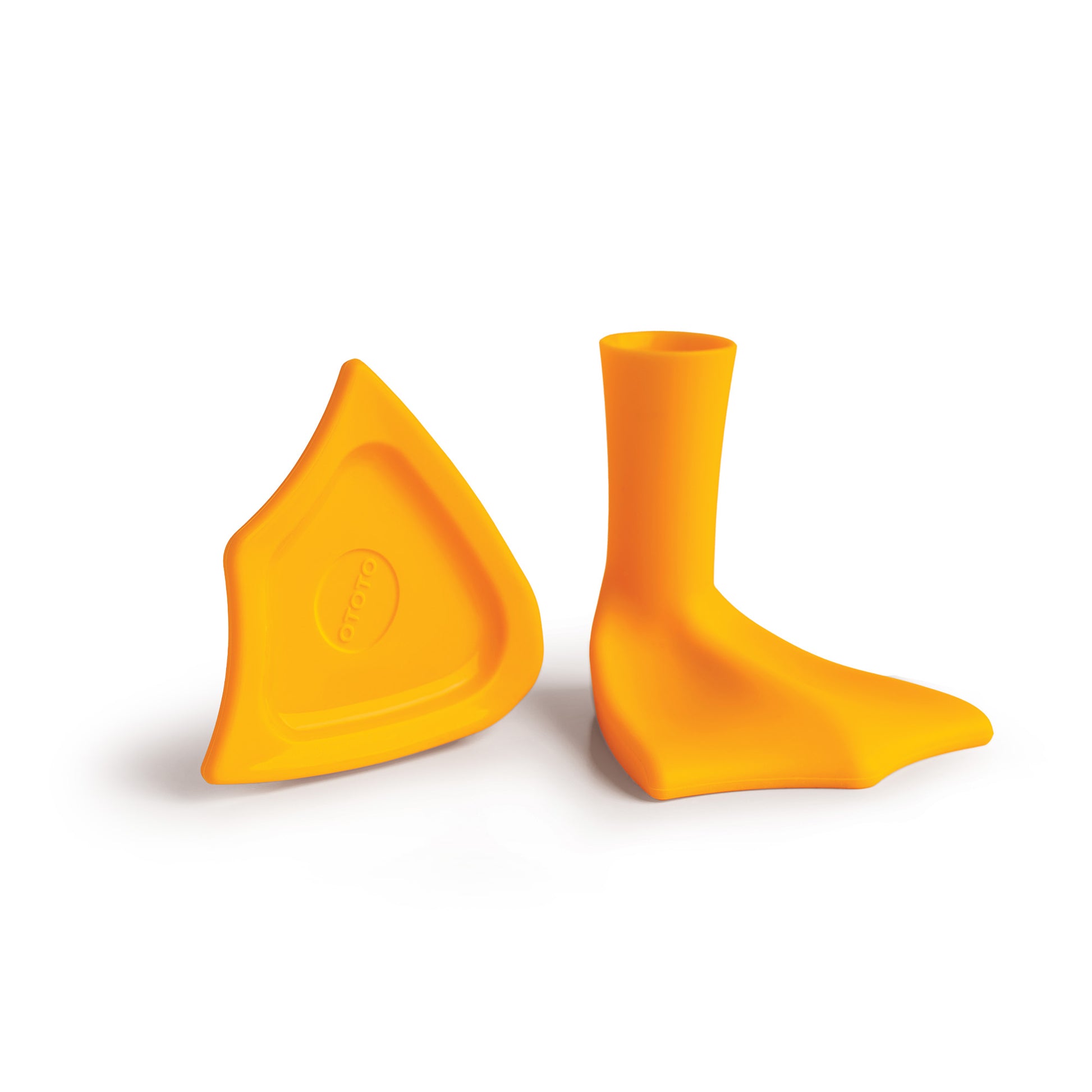 Two orange Duck-Clean toothbrush holders shaped like duck feet sit on a white background.